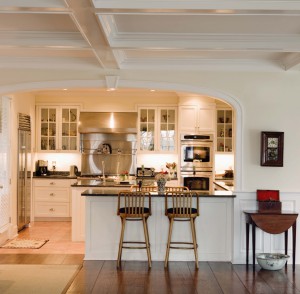 Kitchen with bar stools at counter